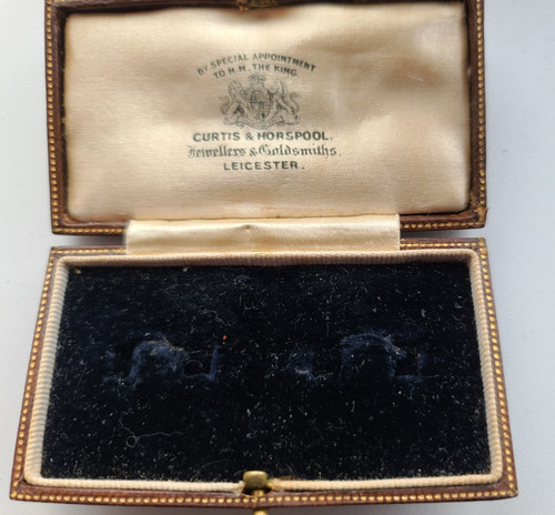 Antique tooled leather brooch